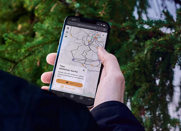 Saariselkä Trails map on a phone, inviting the visitor to buy the digital map