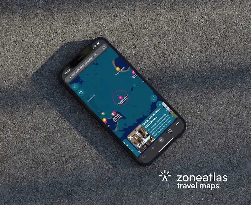 Zoneatlas travel maps on smartphone displaying destination attractions with storytelling features and interactive location details for tourism planning