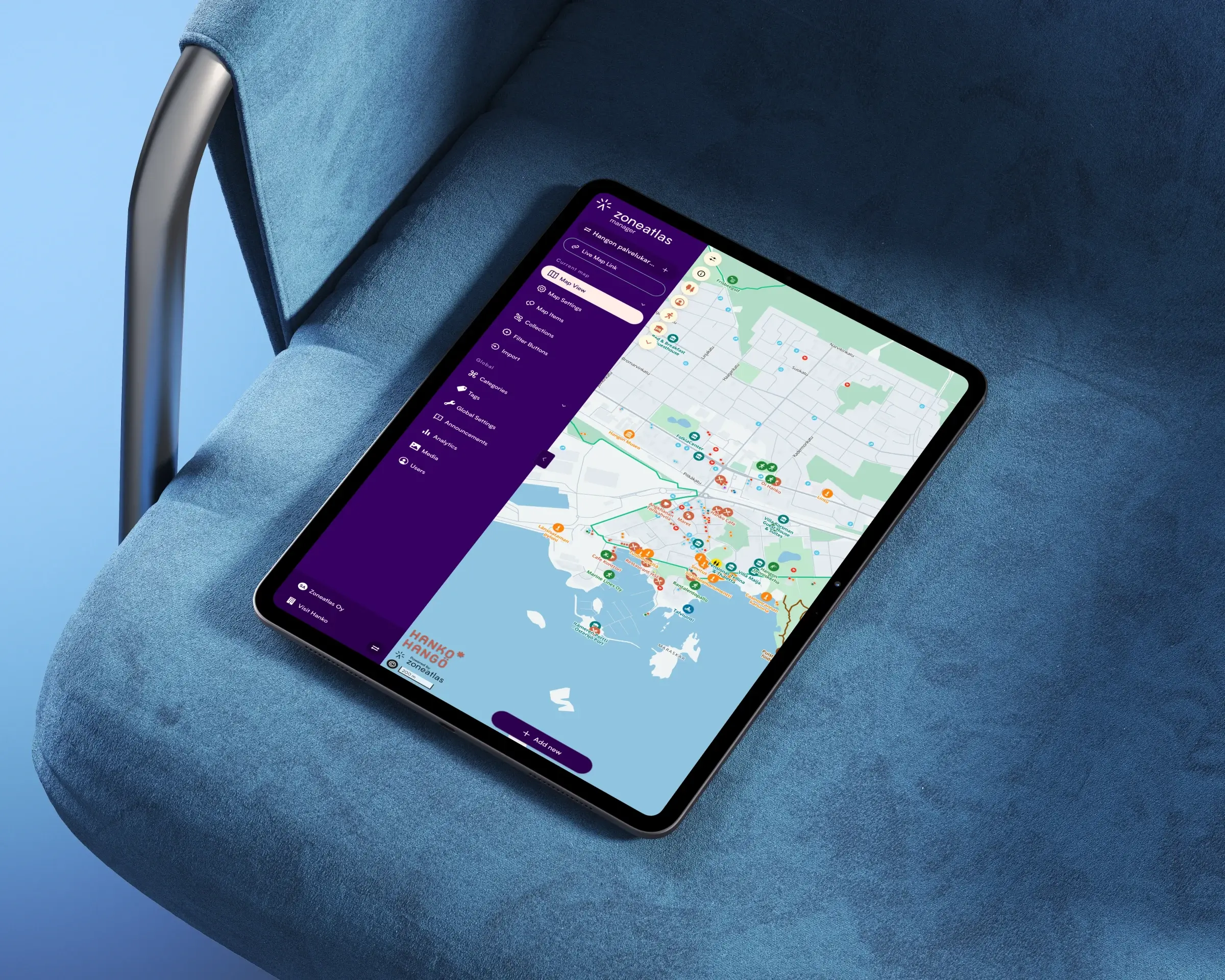 Tablet showing an interactive city map with a category menu, made in the Zoneatlas map editor